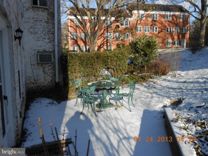 3203 Gunston Road, Unit 11032 Alexandria, VA 22302 - Photo 16 of 20 a view of a patio with table and chairs and potted plants