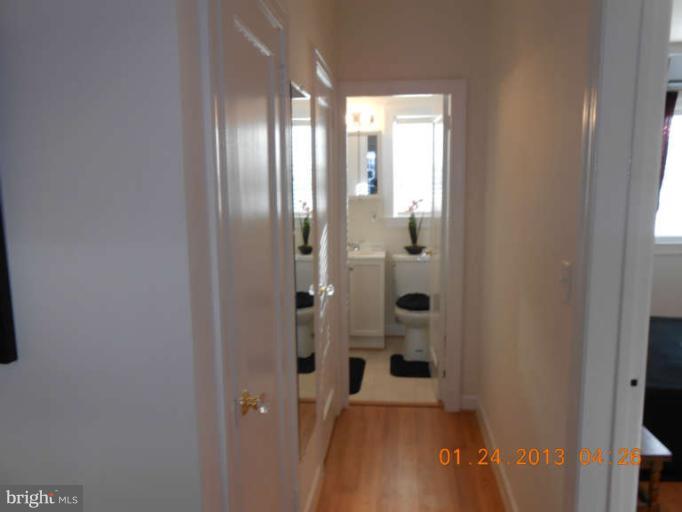 3203 Gunston Road, Unit 11032 Alexandria, VA 22302 - Photo 8 of 20 a bathroom with a glass door shower