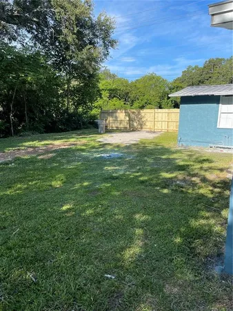 a view of a big yard with a house