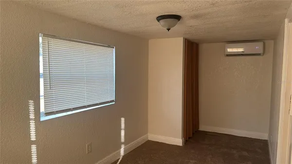 a view of an empty room with a window