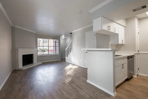 a view of kitchen and entryway with wooden floor