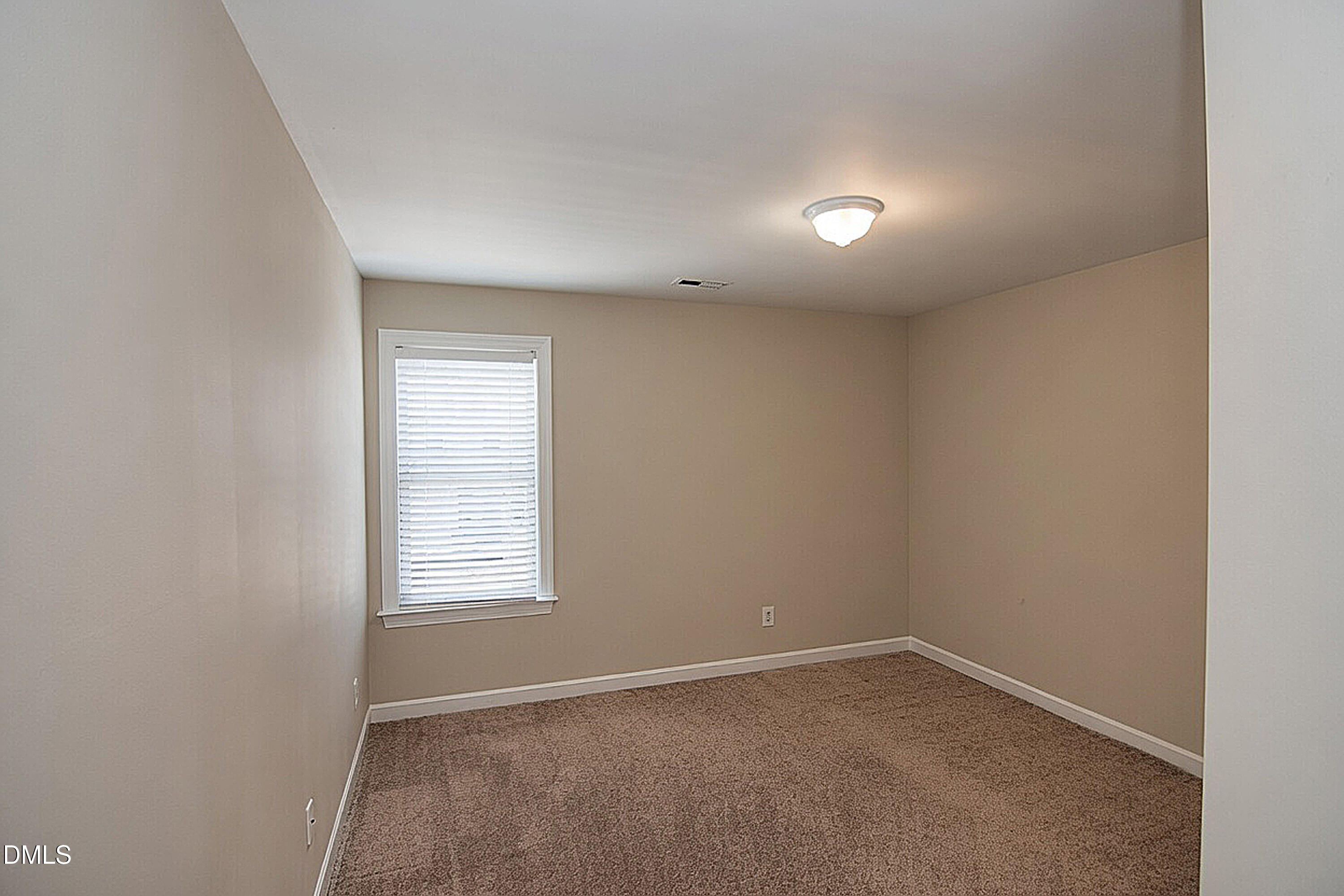 4809 Landover Pine Place Raleigh, NC 27616 - Photo 10 of 14 an empty room with windows