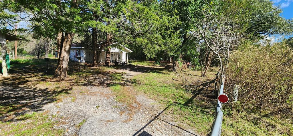 1577 U.S. Highway 190, Unit A Huntsville, TX 77340 - Photo 1 of 6 a backyard of a house with lots of green space