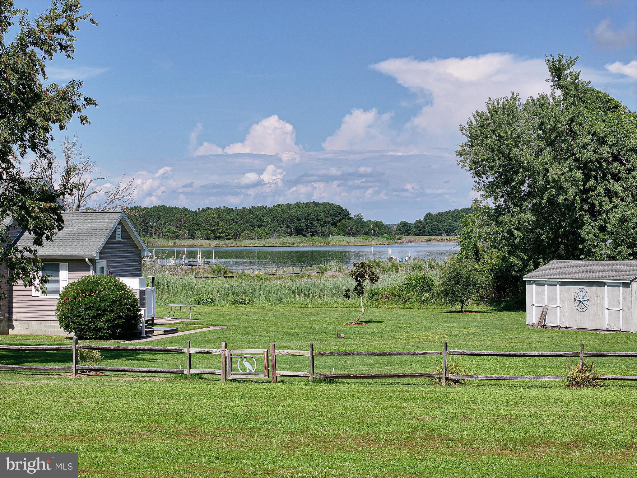 21869 Albie Road Sherwood, MD 21665 - Photo 1 of 38 a view of a golf course with a lake