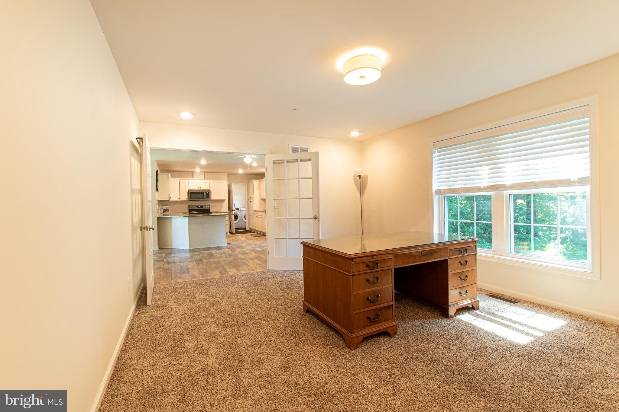 21869 Albie Road Sherwood, MD 21665 - Photo 14 of 38 a view of living room with furniture and a fireplace