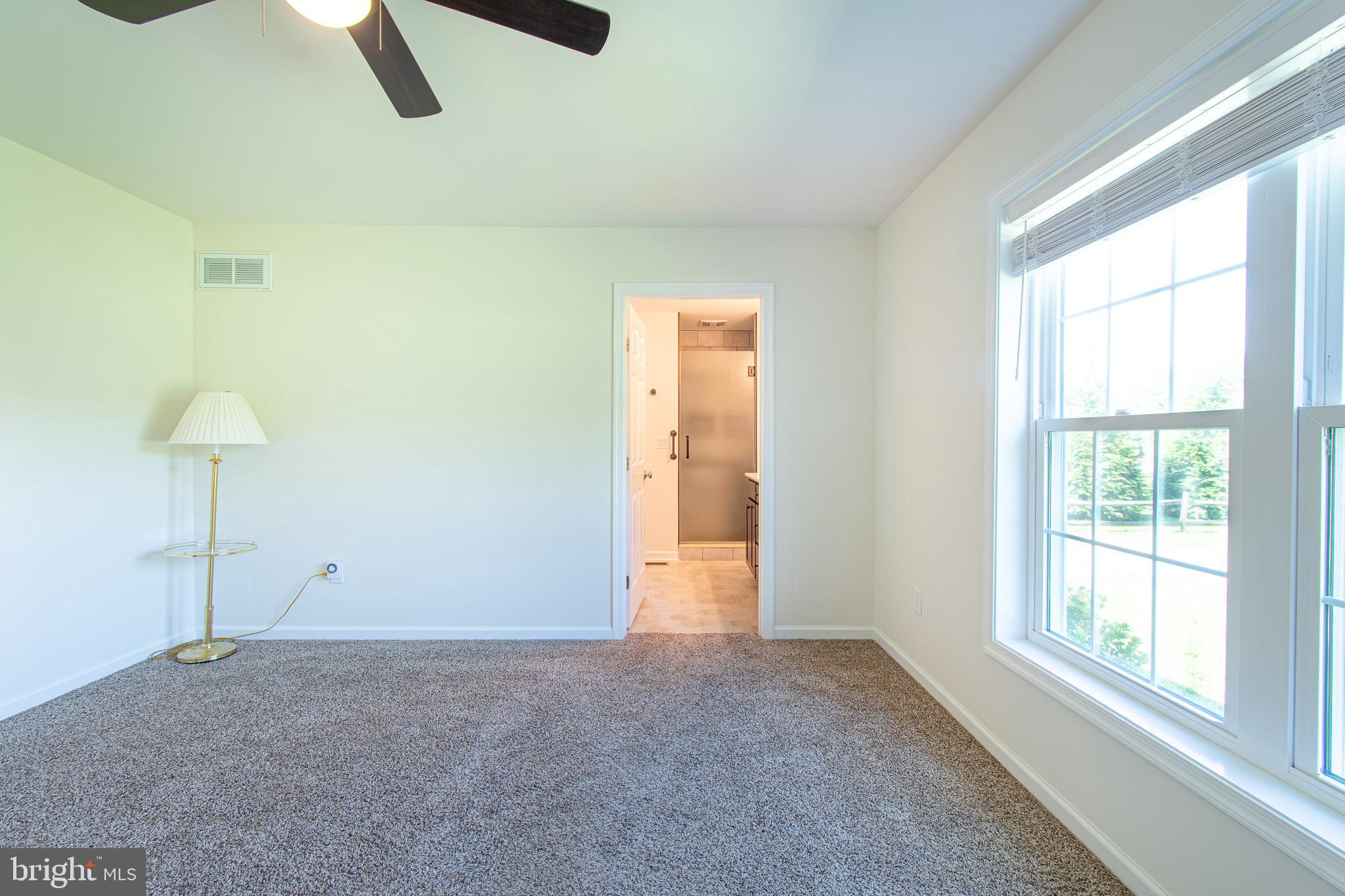 21869 Albie Road Sherwood, MD 21665 - Photo 19 of 38 a view of an empty room with a window