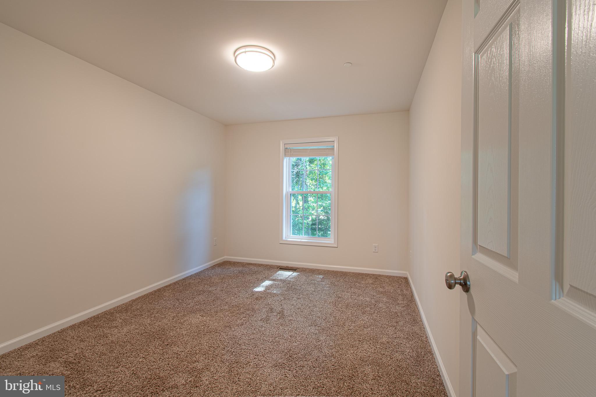 21869 Albie Road Sherwood, MD 21665 - Photo 24 of 38 an empty room with windows