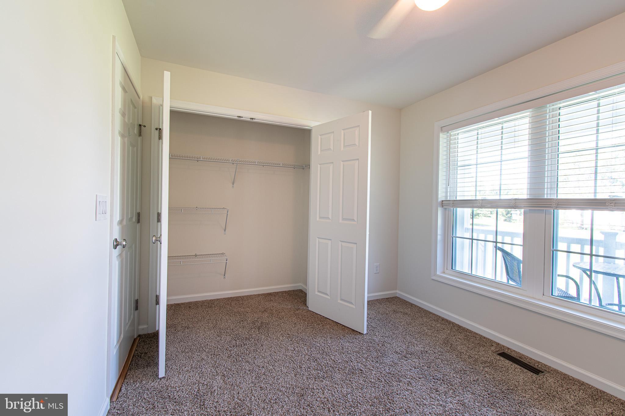 21869 Albie Road Sherwood, MD 21665 - Photo 27 of 38 an empty room with windows and closet