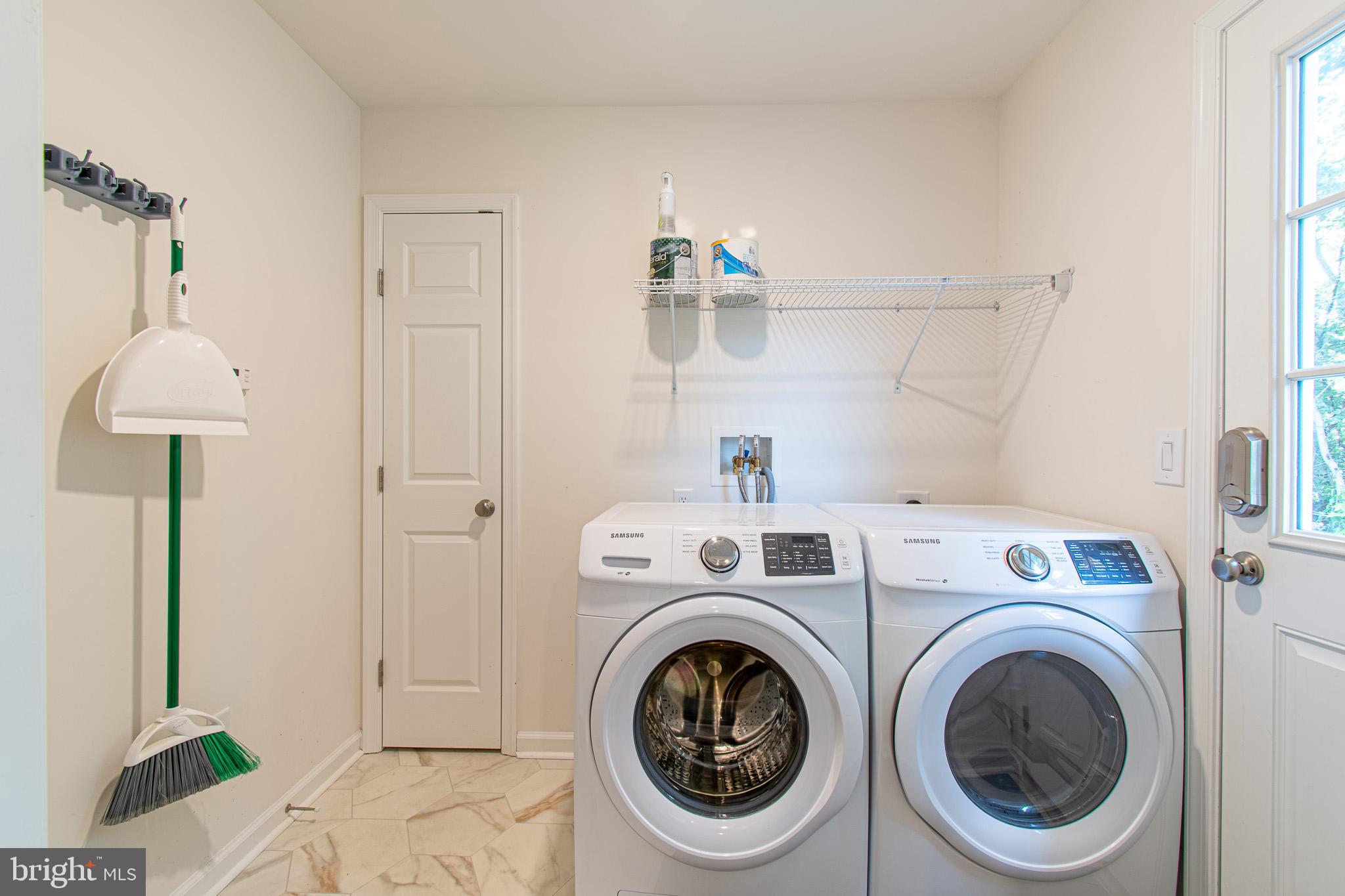 21869 Albie Road Sherwood, MD 21665 - Photo 28 of 38 a view of a storage & utility room with washer and dryer