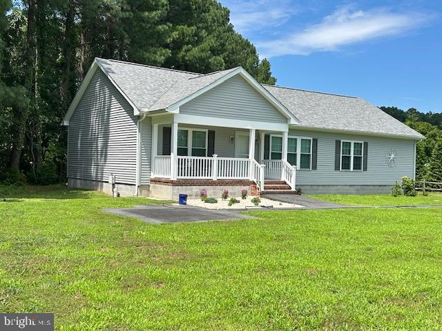 21869 Albie Road Sherwood, MD 21665 - Photo 29 of 38 a view of a house with a yard patio and a small yard