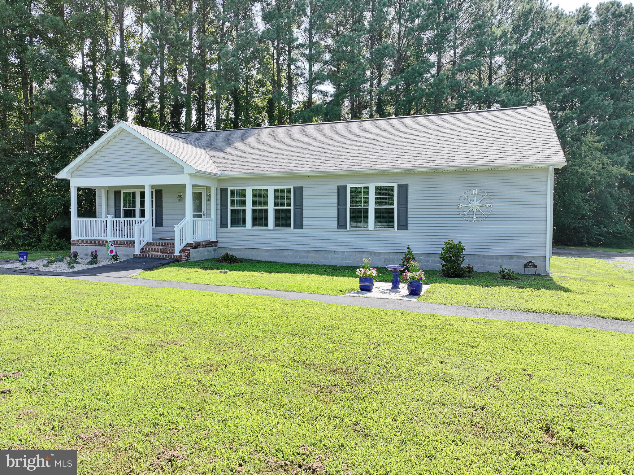 21869 Albie Road Sherwood, MD 21665 - Photo 36 of 38 a front view of a house with swimming pool having outdoor seating