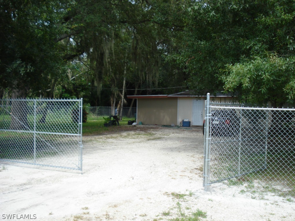 4549 Ballard Road Fort Myers, FL 33905 - Photo 3 of 4 a view of a backyard with fence