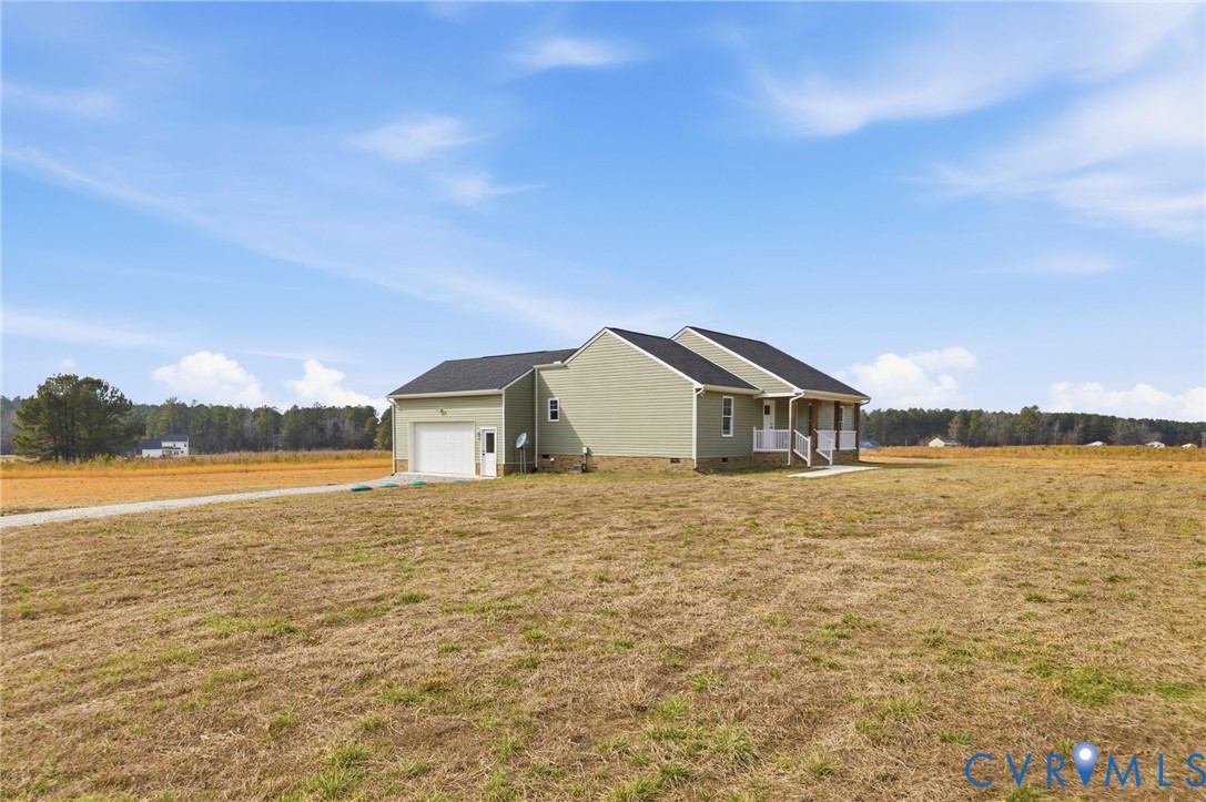 5245 Courtland Road Disputanta, VA 23842 - Photo 2 of 27 a house with yard and ocean view