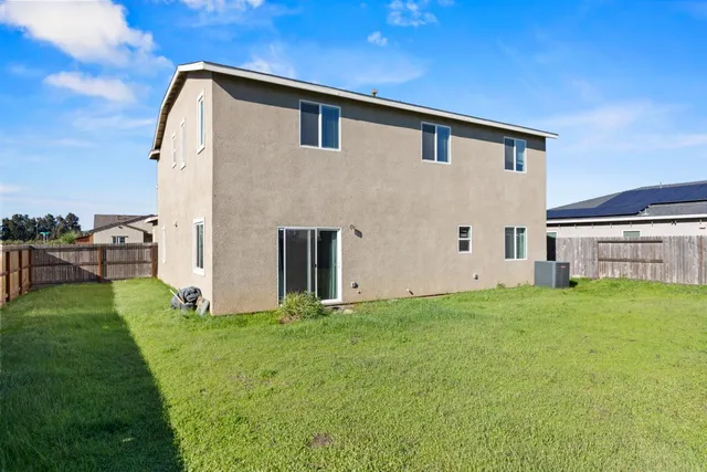 a view of backyard with green space