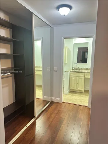 a kitchen with stainless steel appliances a white stove top oven a sink and a refrigerator