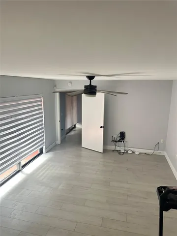 a view of a room with closet and a window