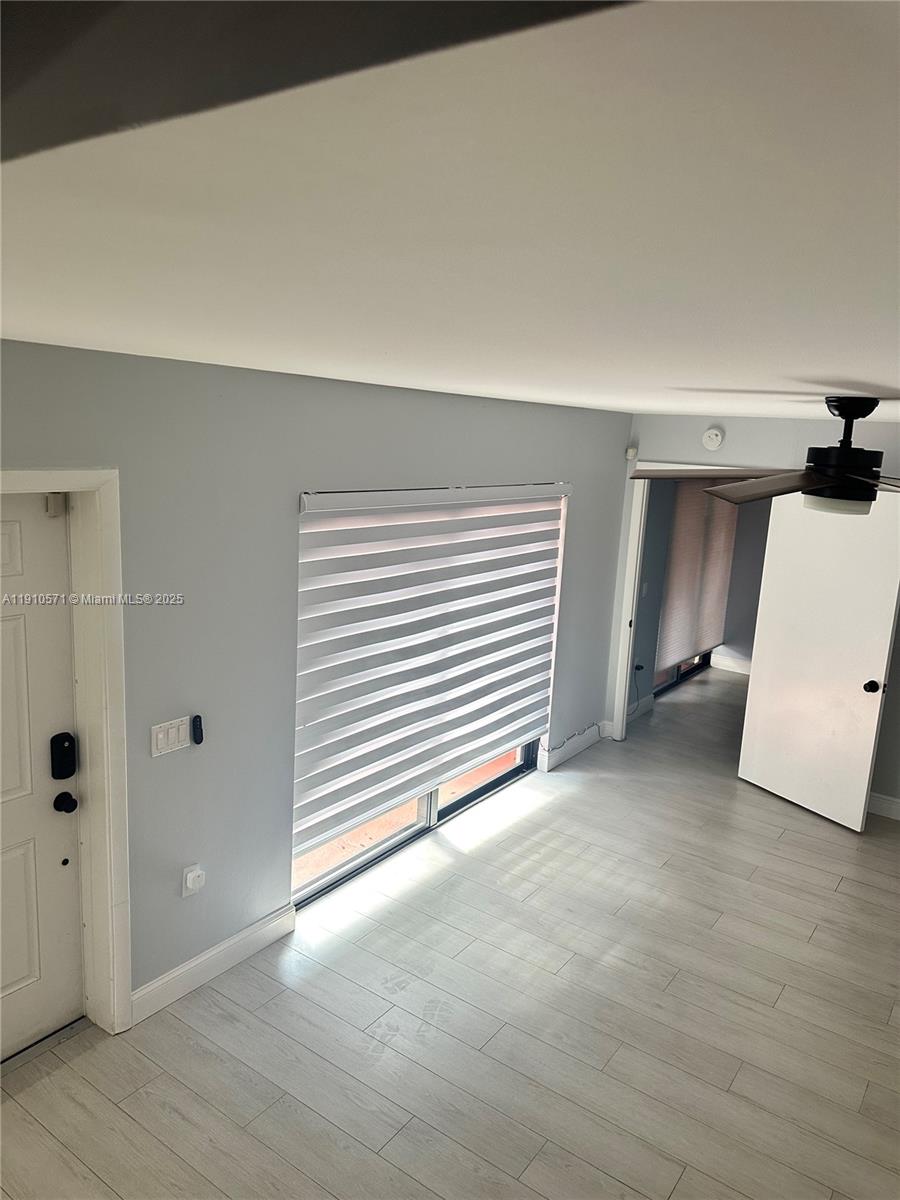 9156 Southwest 23rd Street, Unit D Davie, FL 33324 - Photo 8 of 14 a view of a room with closet and a window
