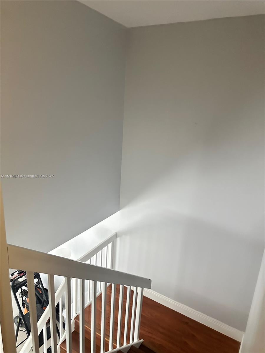 9156 Southwest 23rd Street, Unit D Davie, FL 33324 - Photo 9 of 14 a view of a hallway with wooden floor