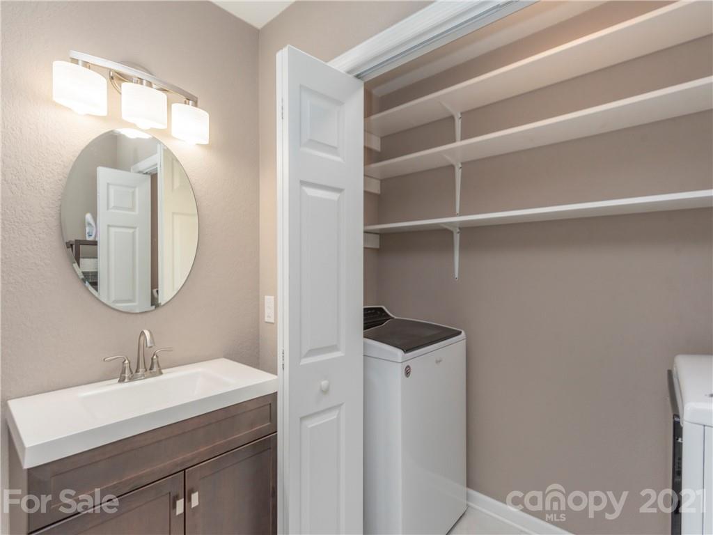 79 Susan Drive Maggie Valley, NC 28751 - Photo 11 of 17 a bathroom with a sink a toilet and a mirror
