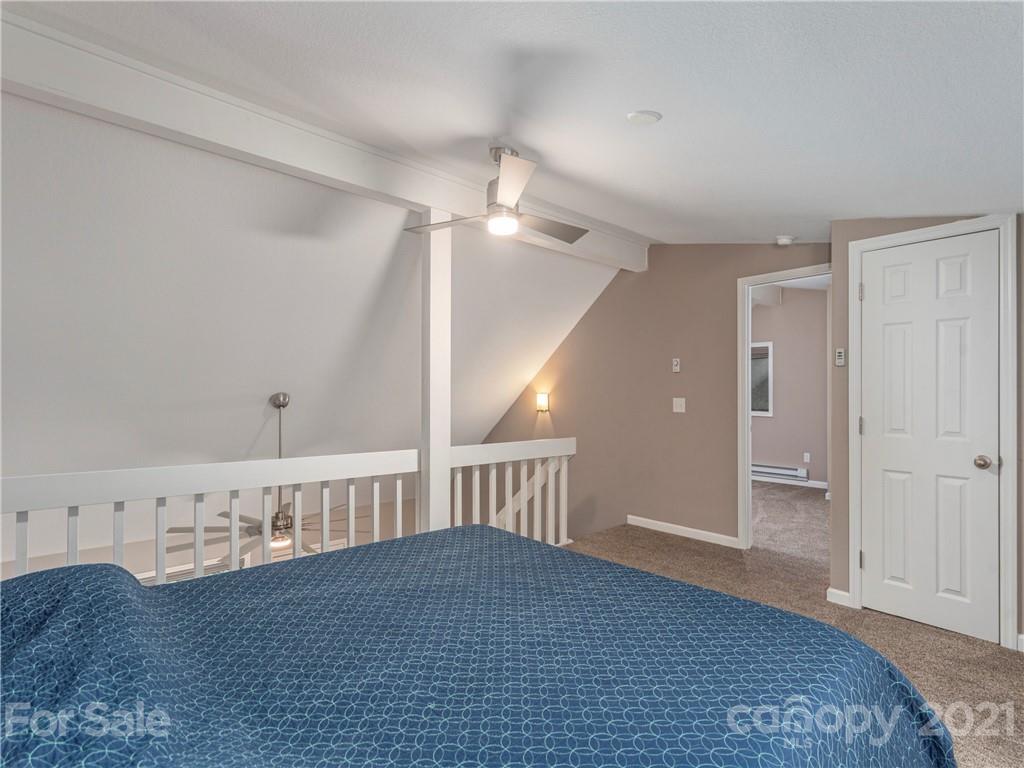 79 Susan Drive Maggie Valley, NC 28751 - Photo 12 of 17 a view of an empty room and chandelier fan
