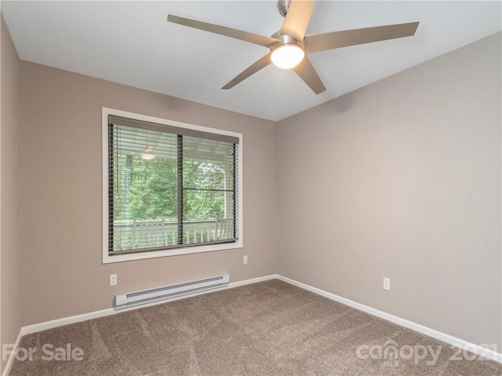 79 Susan Drive Maggie Valley, NC 28751 - Photo 9 of 17 an empty room with a window and a fan