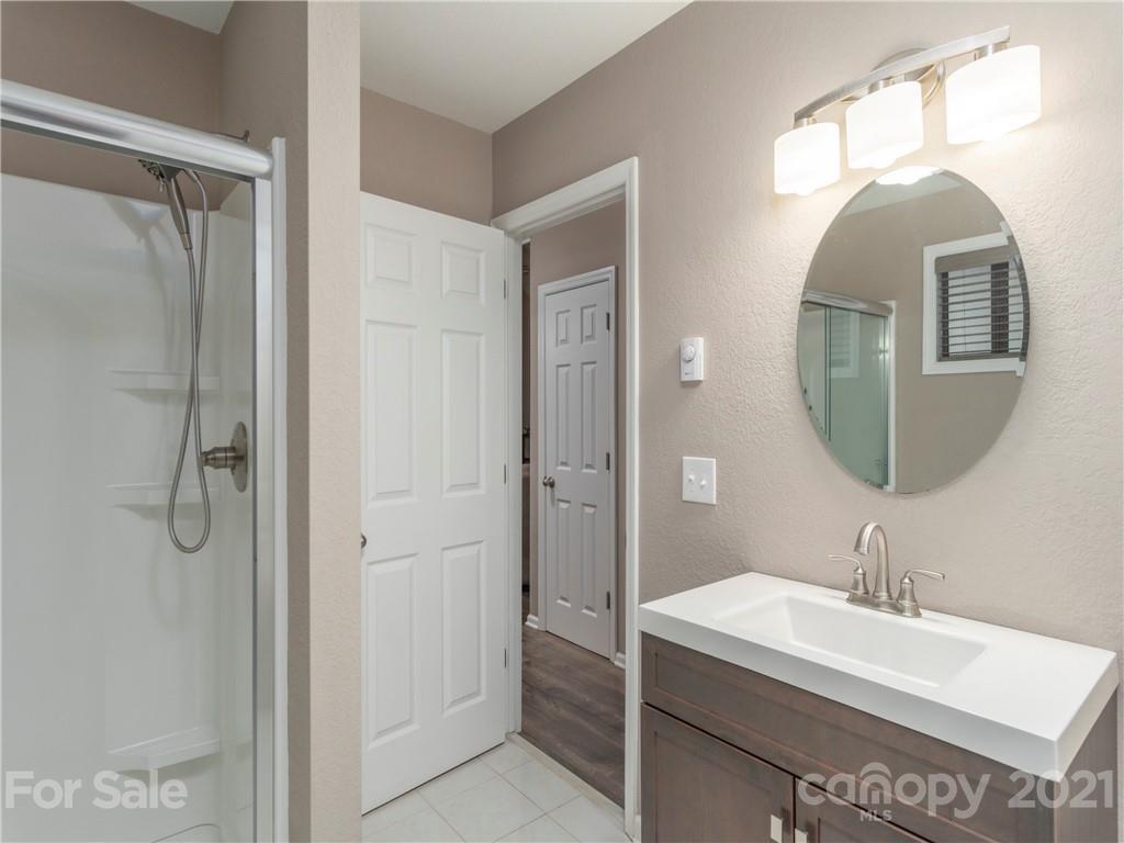79 Susan Drive Maggie Valley, NC 28751 - Photo 10 of 17 a bathroom with a sink and a mirror