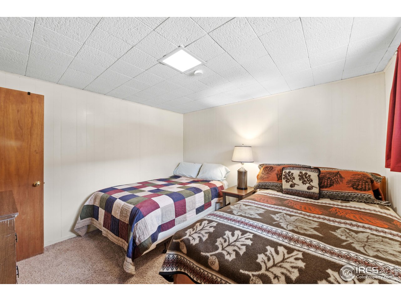 654 Hemlock Drive Lyons, CO 80540 - Photo 12 of 32 a bedroom with a bed and a night stand