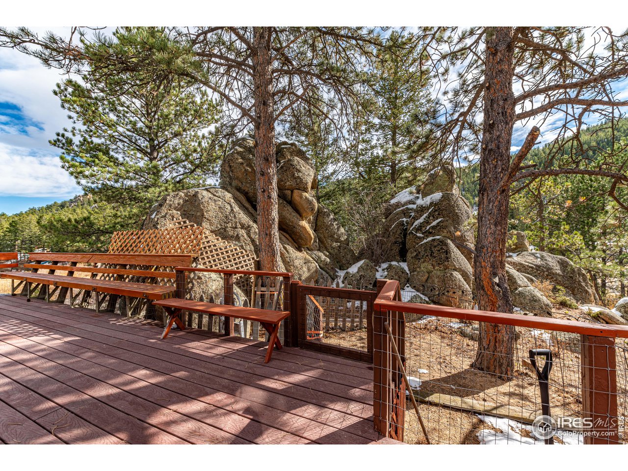 654 Hemlock Drive Lyons, CO 80540 - Photo 21 of 32 a view of a bench in a backyard