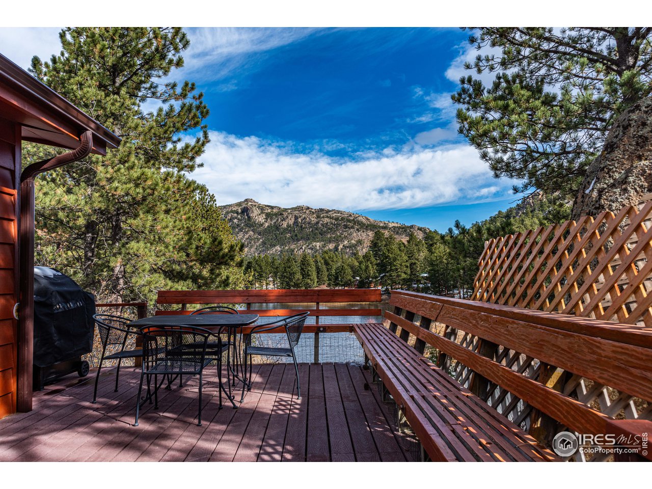 654 Hemlock Drive Lyons, CO 80540 - Photo 23 of 32 a balcony with wooden floor table and chairs