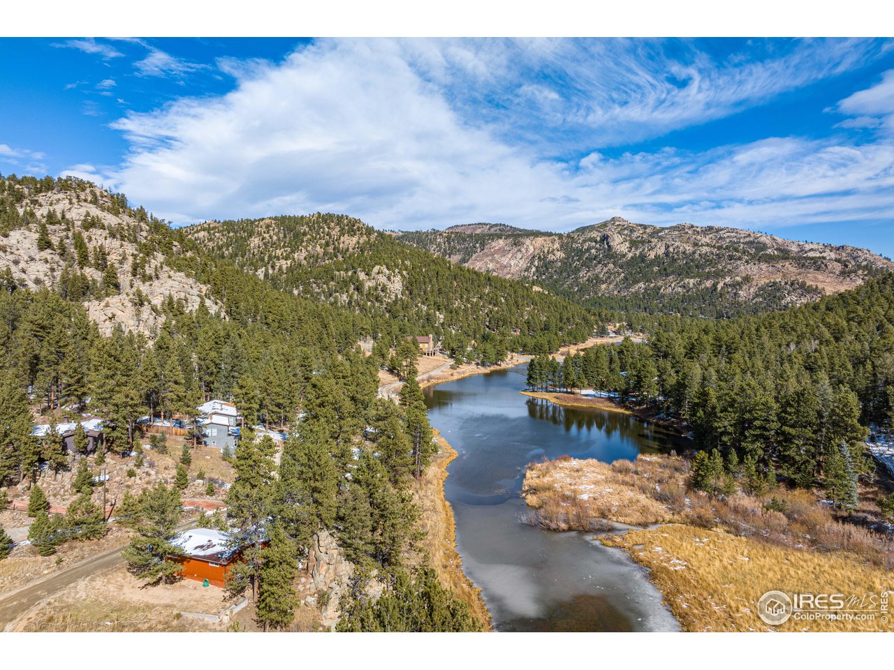 654 Hemlock Drive Lyons, CO 80540 - Photo 24 of 32 a view of a lake with a mountain