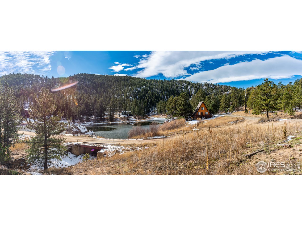 654 Hemlock Drive Lyons, CO 80540 - Photo 27 of 32 a view of a town with mountains in the background