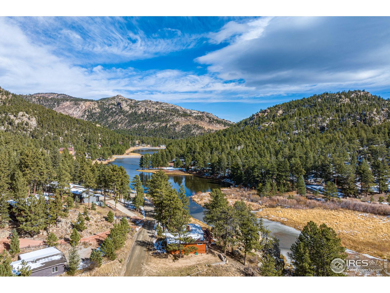 654 Hemlock Drive Lyons, CO 80540 - Photo 31 of 32 a view of a lake with a mountain