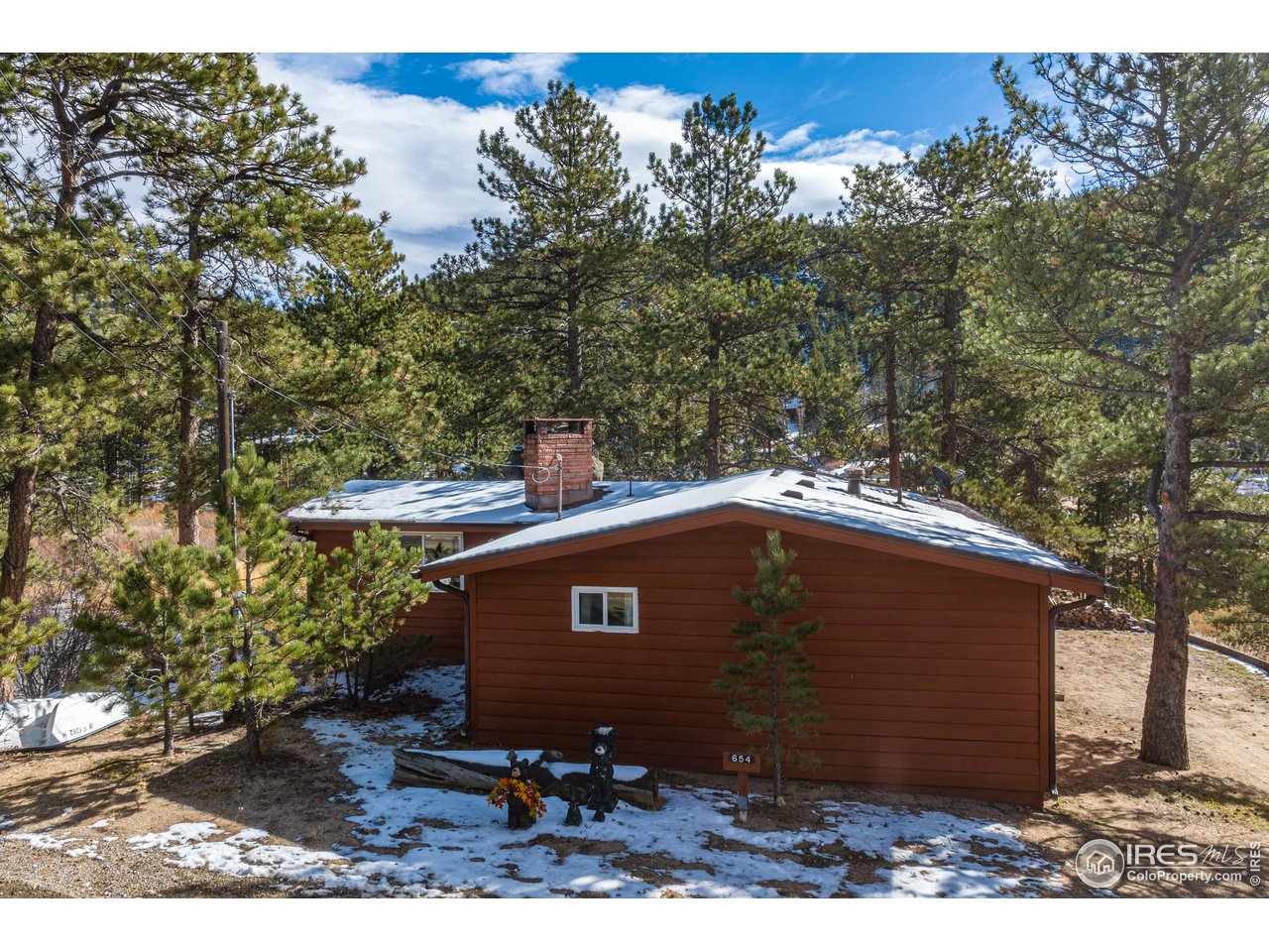 654 Hemlock Drive Lyons, CO 80540 - Photo 32 of 32 a view of a small house with a yard