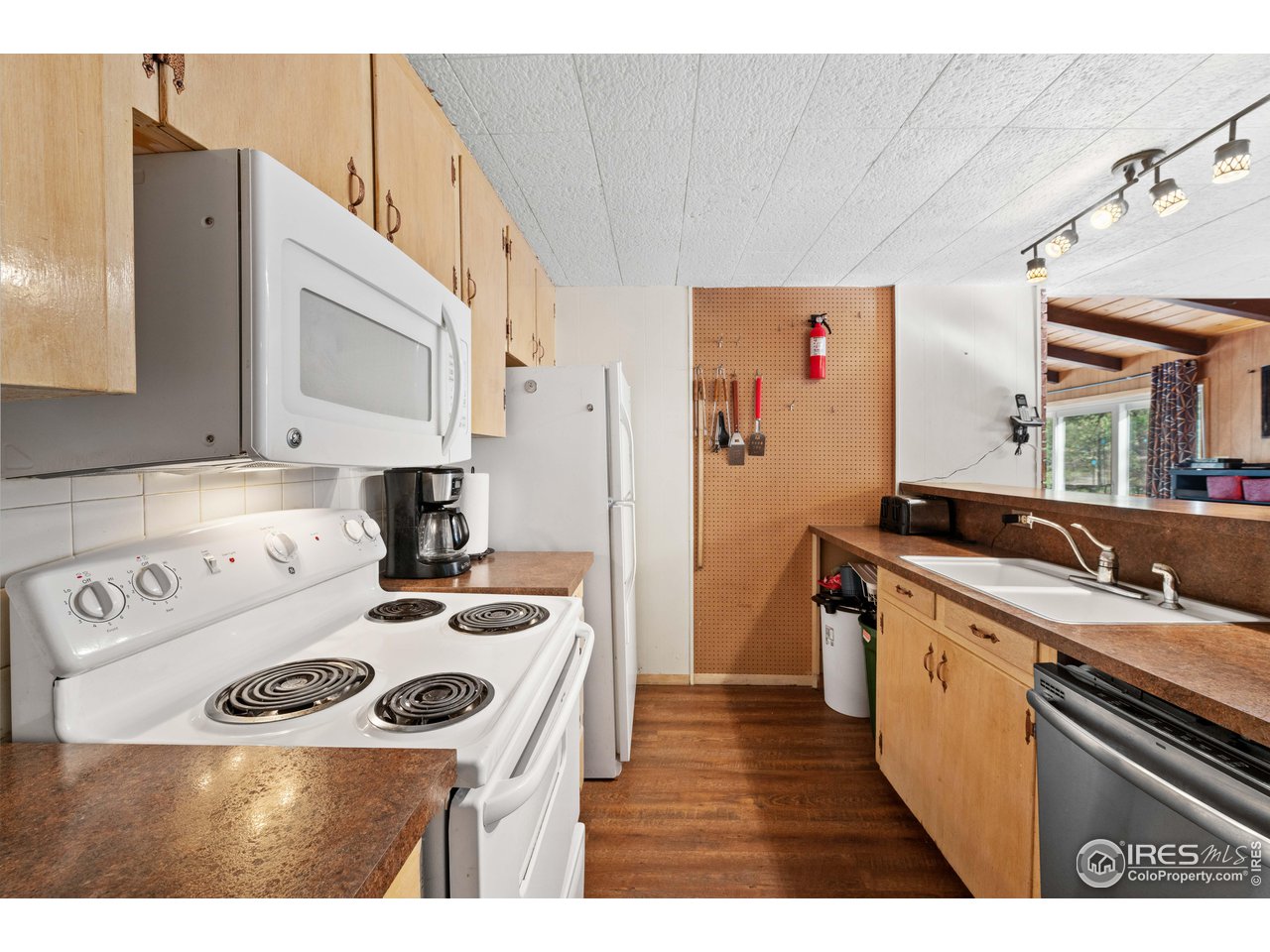 654 Hemlock Drive Lyons, CO 80540 - Photo 6 of 32 a kitchen with a sink a stove and cabinets