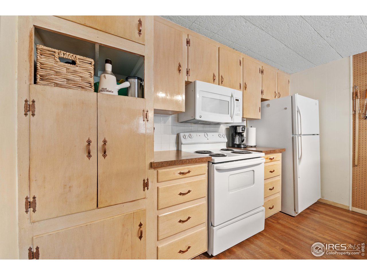 654 Hemlock Drive Lyons, CO 80540 - Photo 7 of 32 a kitchen with stainless steel appliances a refrigerator sink and cabinets