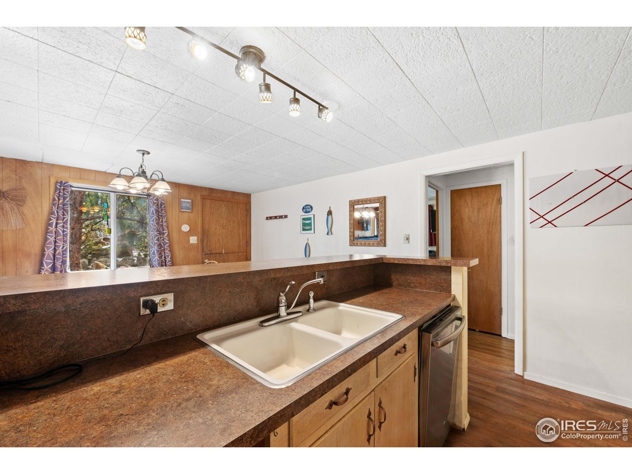 654 Hemlock Drive Lyons, CO 80540 - Photo 8 of 32 a bathroom with a sink and a mirror