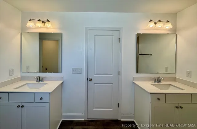 a bathroom with a sink and mirror