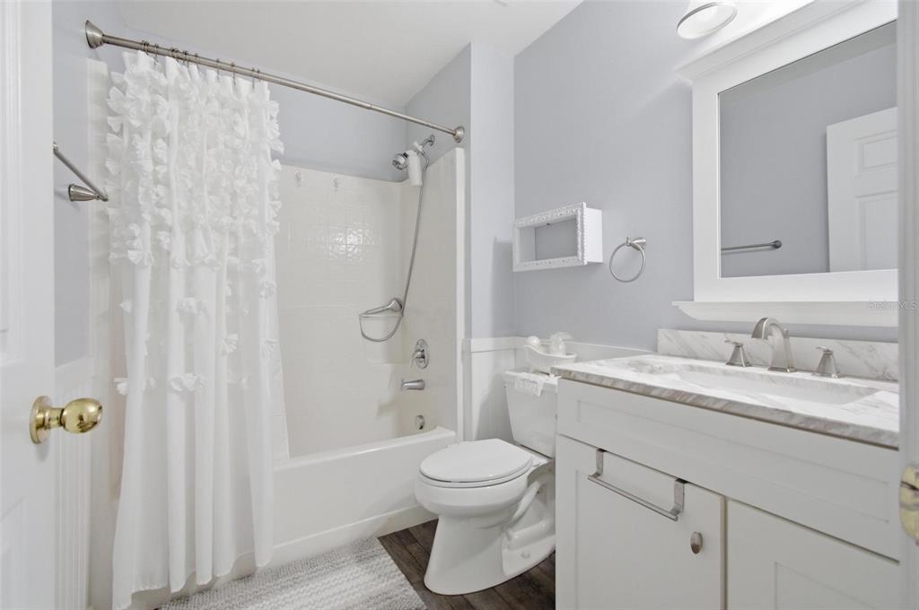 13 Slowdrift Palm Coast, FL 32164 - Photo 23 of 58 a bathroom with a granite countertop sink toilet and shower