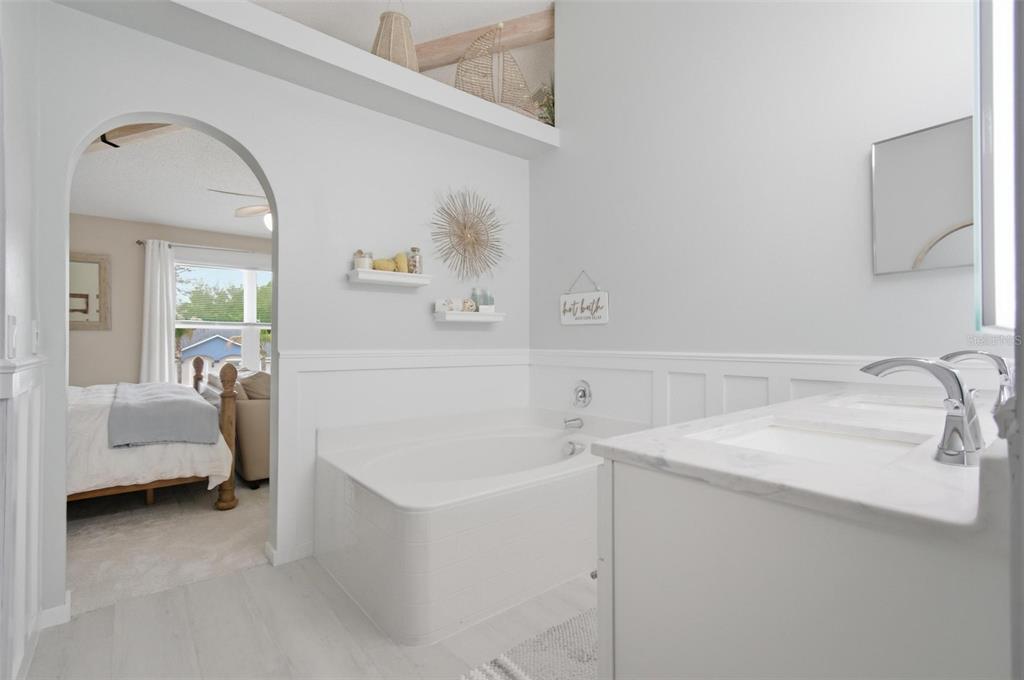 13 Slowdrift Palm Coast, FL 32164 - Photo 29 of 58 a bathroom with a sink and a mirror
