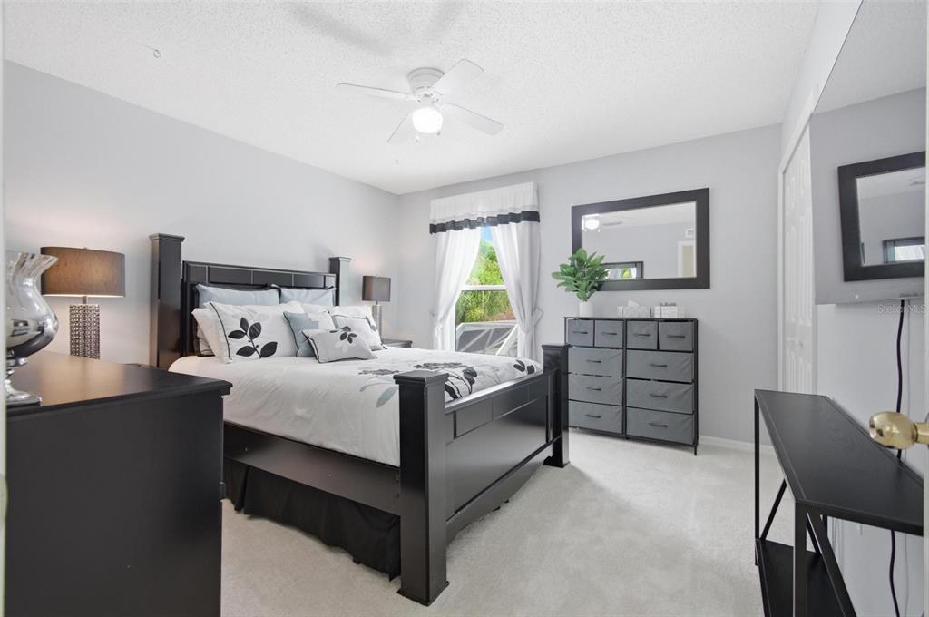 13 Slowdrift Palm Coast, FL 32164 - Photo 35 of 58 a bedroom with a bed window and a chair