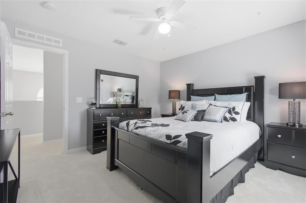 13 Slowdrift Palm Coast, FL 32164 - Photo 36 of 58 a bed room with bed and window