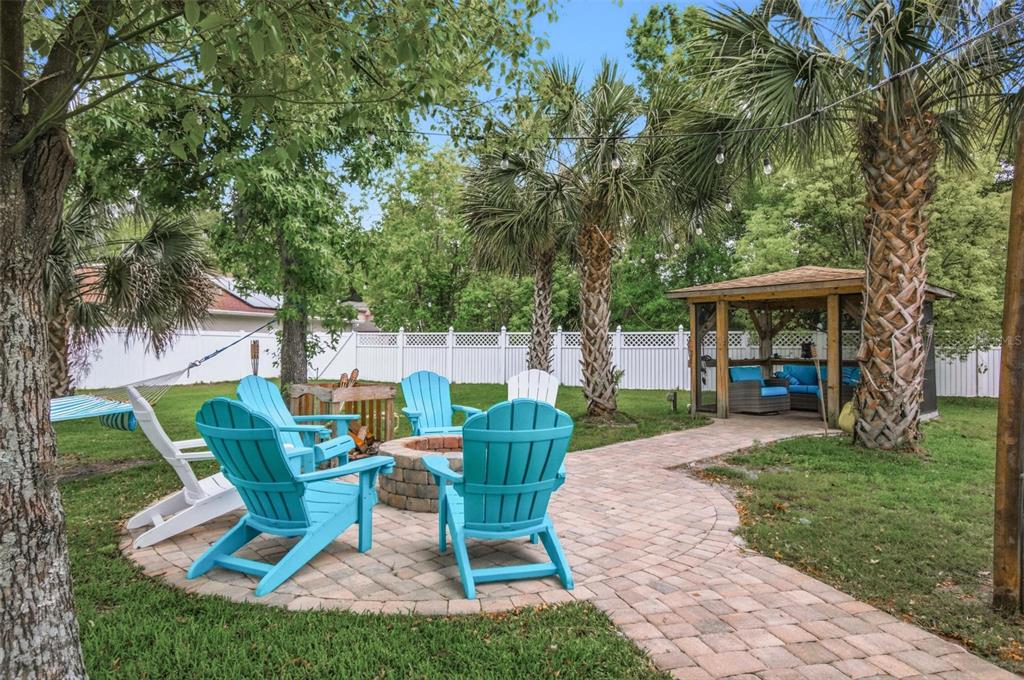 13 Slowdrift Palm Coast, FL 32164 - Photo 49 of 58 a view of a house with backyard sitting area and garden