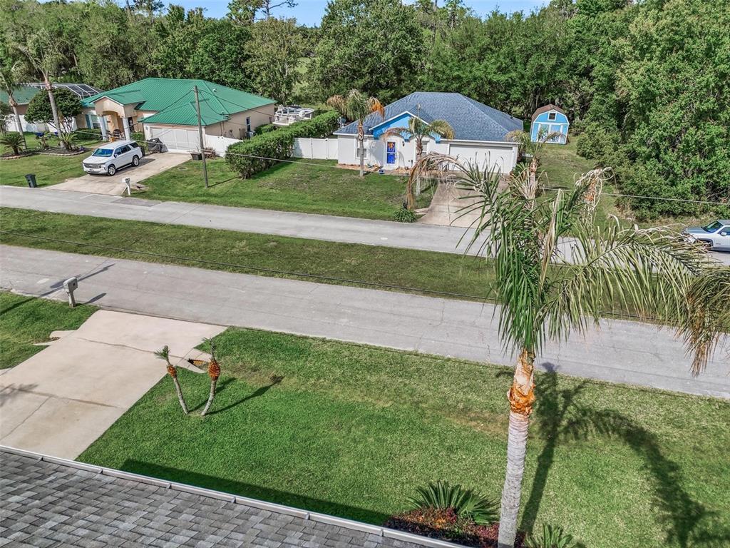 13 Slowdrift Palm Coast, FL 32164 - Photo 55 of 58 an aerial view of a house with a yard and lake view
