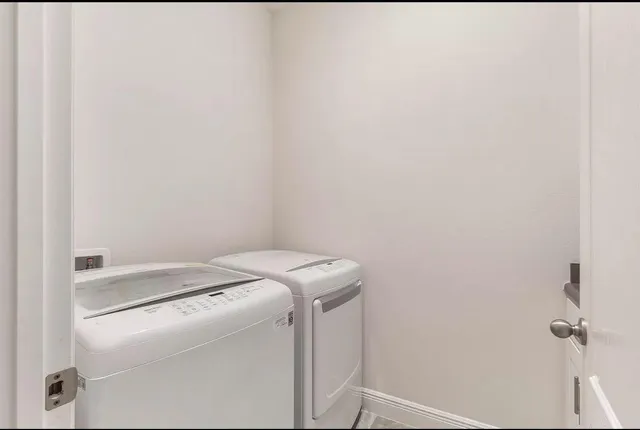 a utility room with dryer and washer