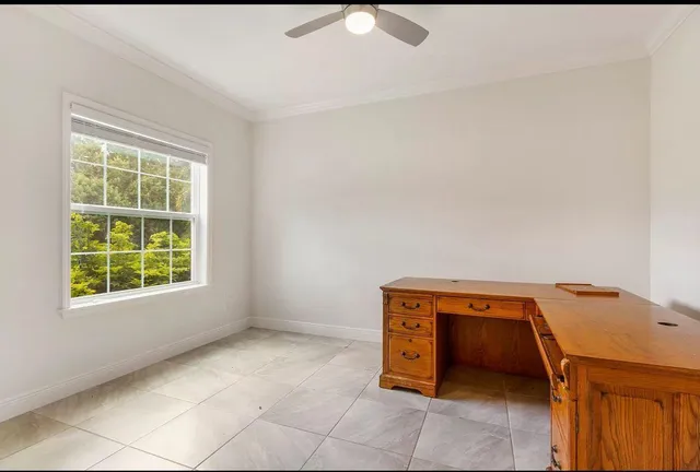 a room with a window and chandelier