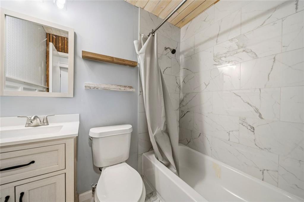 2702 Davenport Road Northwest Duluth, GA 30096 - Photo 14 of 48 a bathroom with a toilet sink and shower