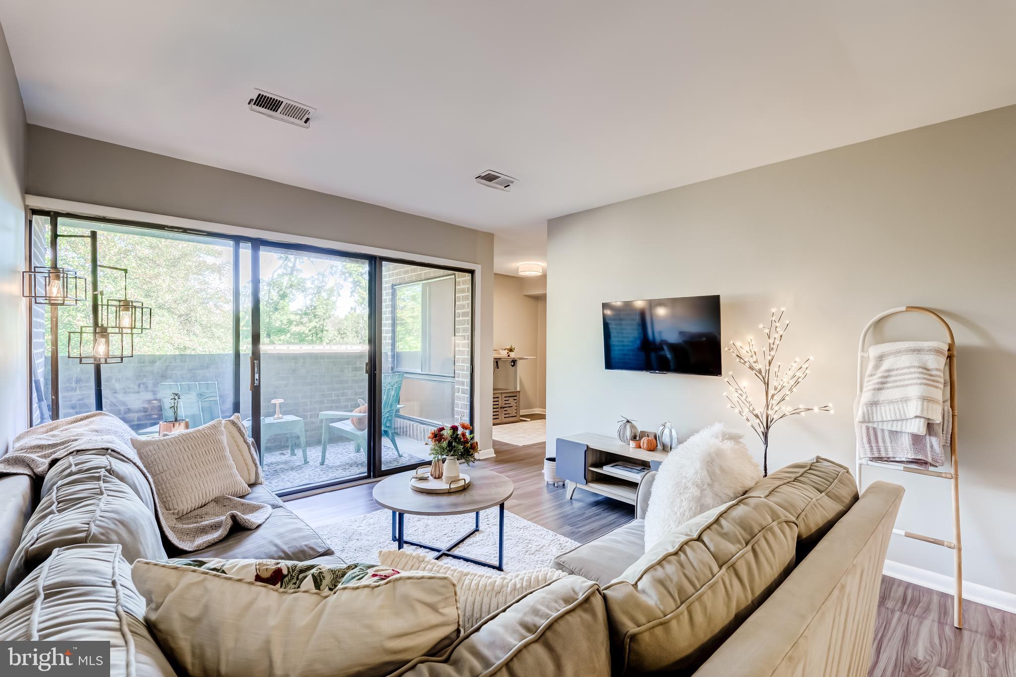 11260 Chestnut Grove Square, Unit 339 Reston, VA 20190 - Photo 2 of 30 Spacious Living Area and Balcony