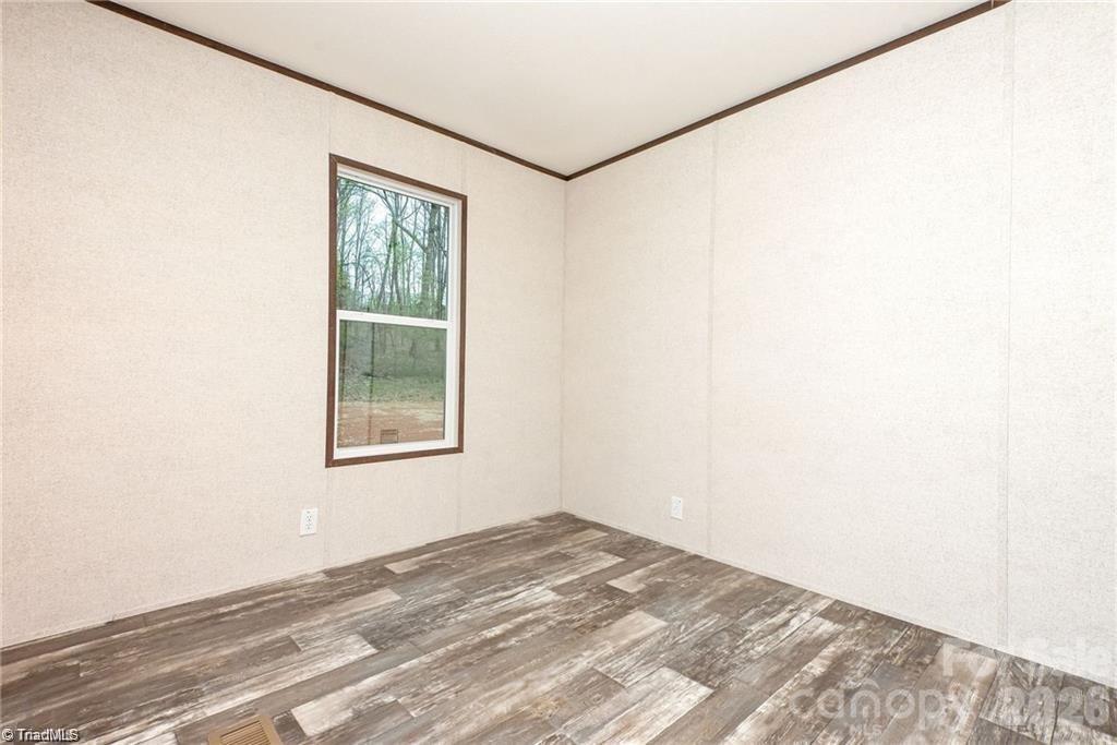 1975 Carl Fox Road Taylorsville, NC 28681 - Photo 11 of 33 a view of a bedroom with a window