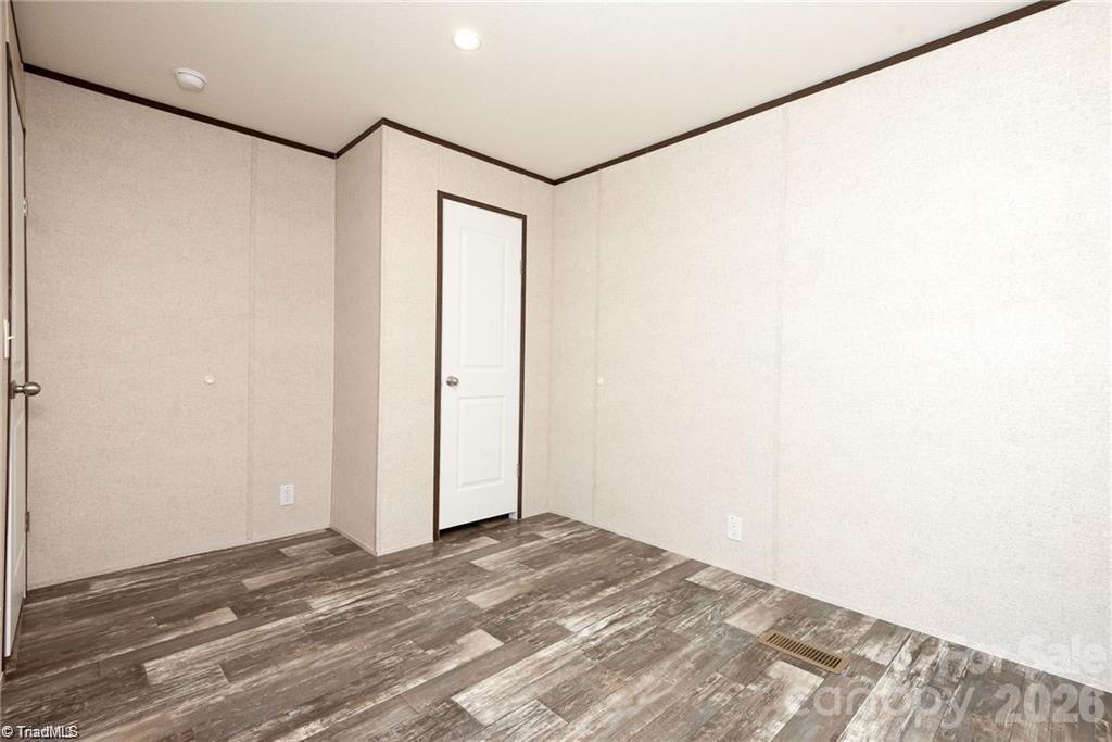 1975 Carl Fox Road Taylorsville, NC 28681 - Photo 13 of 33 a view of a room with wooden floor