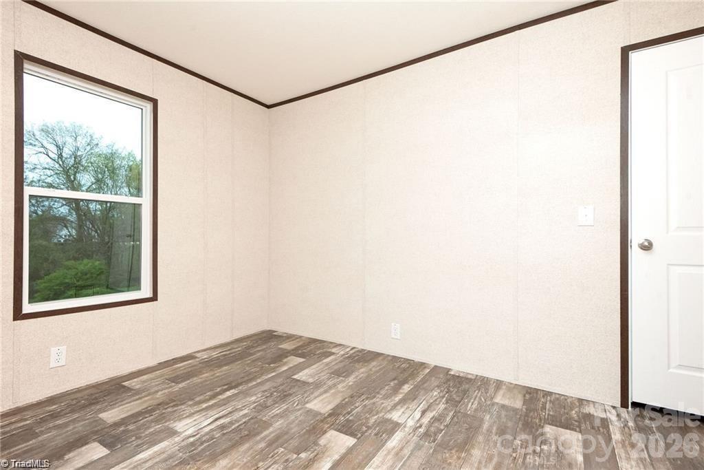 1975 Carl Fox Road Taylorsville, NC 28681 - Photo 17 of 33 a view of a small space with wooden floor and a window